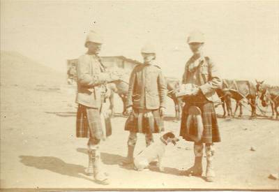 Kilted Scots with their mascot.
