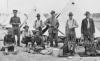 Informal group portrait of members of the 9th Australian Light Horse Regiment attending to their kit.