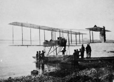 A Royal Navy, Henri Farman, tandem seated float plane, possibly from HMS Ark Royal, returning to its launching ramp.